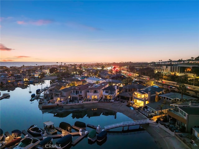 bird's eye view featuring a residential view and a water view