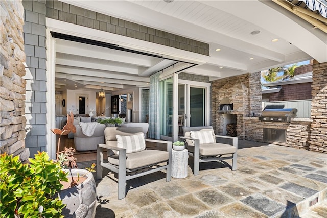 view of patio with a grill and exterior kitchen