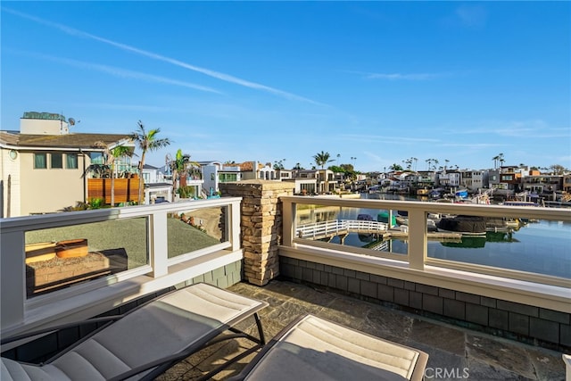 exterior space featuring a residential view and a water view