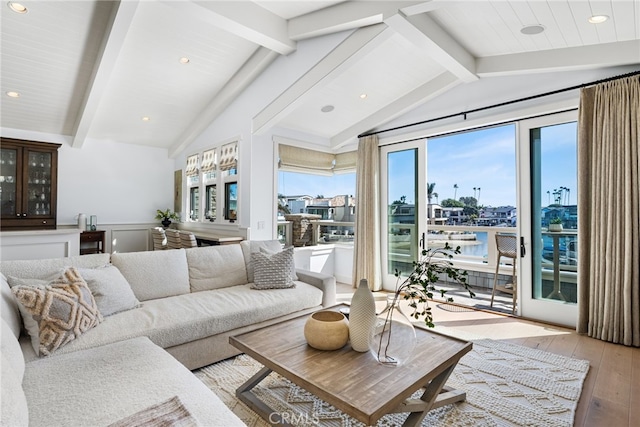 living room featuring recessed lighting, vaulted ceiling with beams, and light wood-style floors