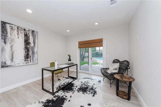 office featuring light wood-style flooring, recessed lighting, baseboards, and visible vents