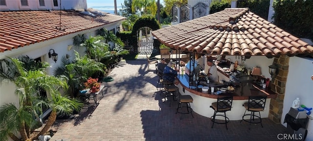 view of patio / terrace featuring outdoor dry bar