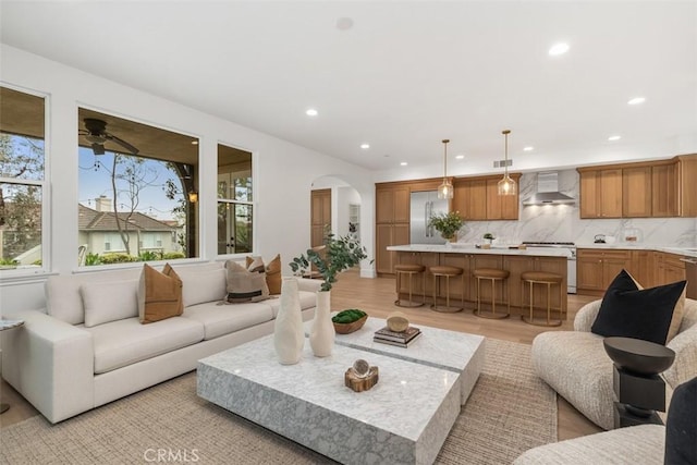 15 Cavaillon, Newport Coast, CA 92657 - living area featuring plenty of natural light, recessed lighting, arched walkways, light wood-type flooring, and ceiling fan