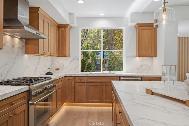 15 Cavaillon, Newport Coast, CA 92657 - kitchen with wall chimney range hood, appliances with stainless steel finishes, light stone countertops, backsplash, and decorative light fixtures
