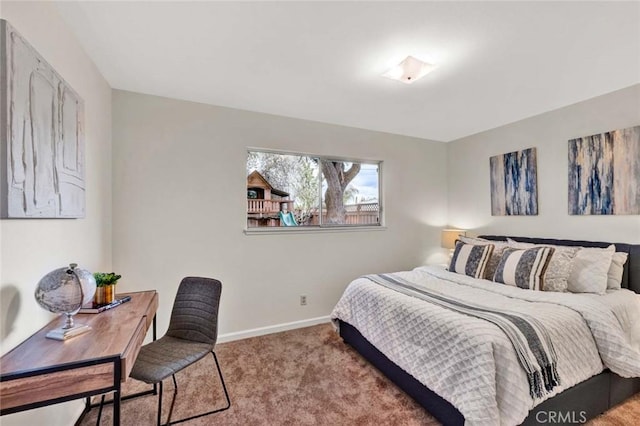 bedroom featuring baseboards and carpet