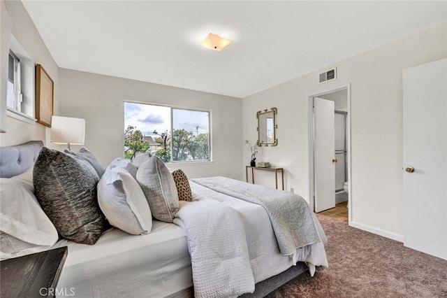 bedroom with visible vents, baseboards, and carpet