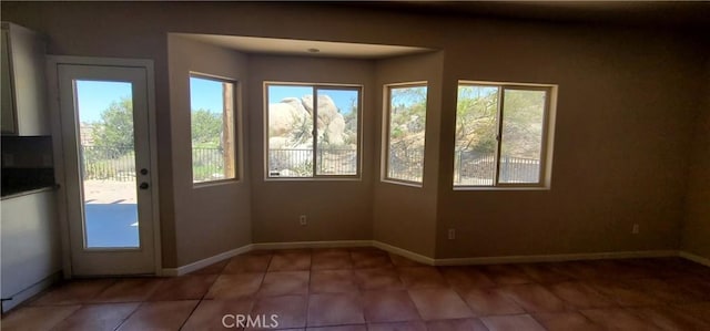 unfurnished sunroom with a healthy amount of sunlight