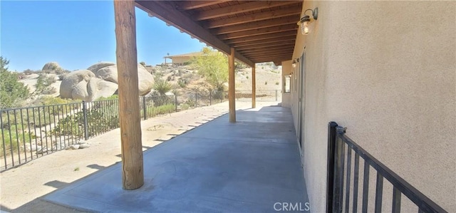 view of patio / terrace featuring fence