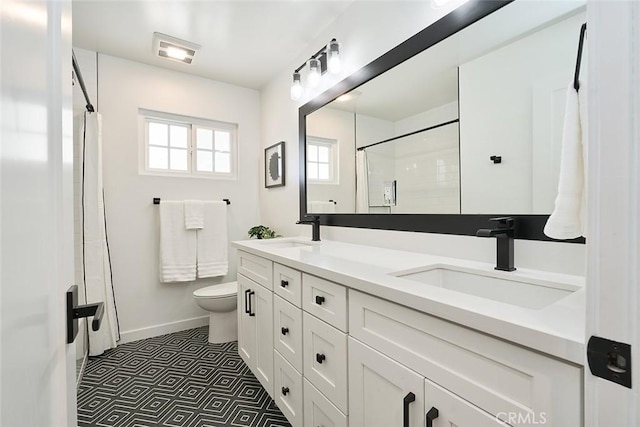 bathroom with a shower with curtain and a sink