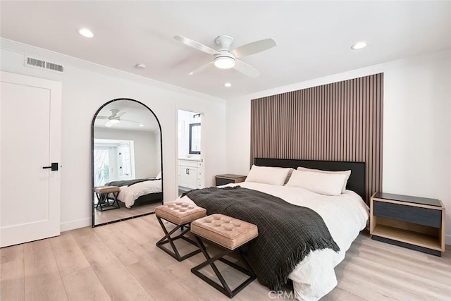 bedroom with recessed lighting, visible vents, light wood-style floors, and crown molding