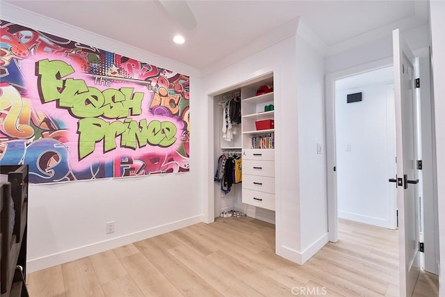 bedroom featuring a closet, visible vents, light wood-type flooring, and baseboards