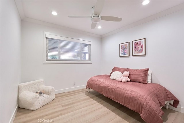 bedroom featuring recessed lighting, crown molding, baseboards, and wood finished floors