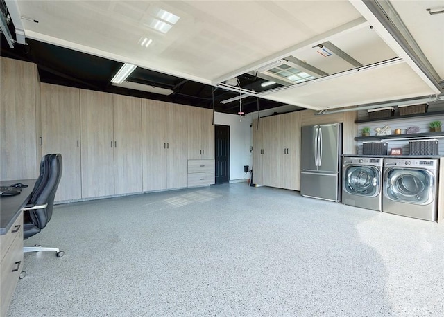 interior space featuring a garage, separate washer and dryer, and speckled floor