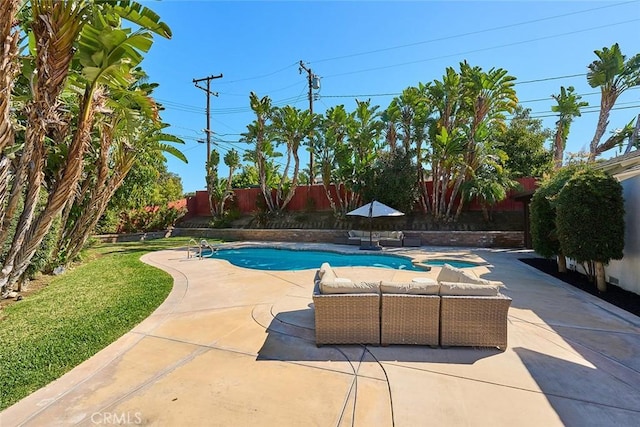 view of swimming pool with an outdoor living space, a fenced in pool, a fenced backyard, and a patio area