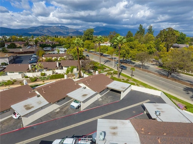 birds eye view of property with a mountain view and a residential view