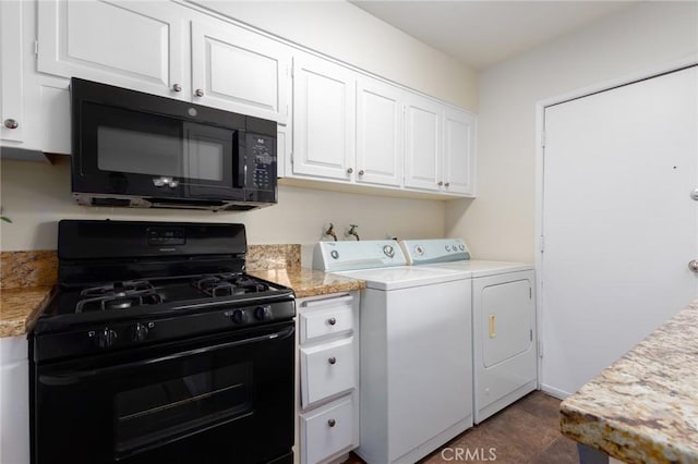 clothes washing area featuring washer and dryer and laundry area