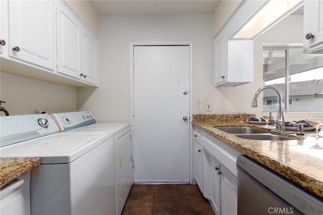 laundry room featuring independent washer and dryer and a sink