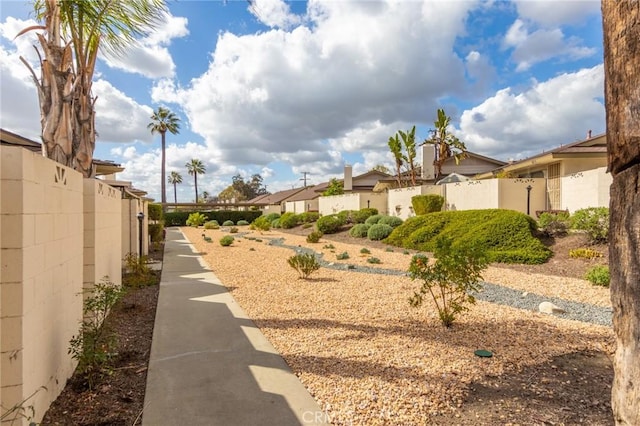 view of yard featuring a residential view and fence