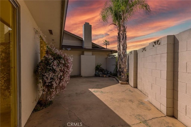 view of patio featuring fence