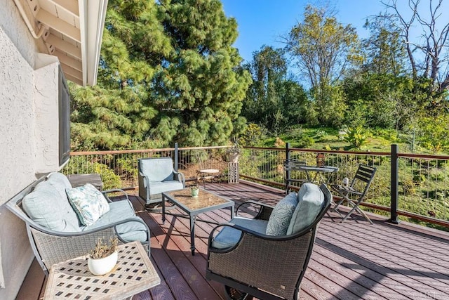 wooden deck with outdoor lounge area