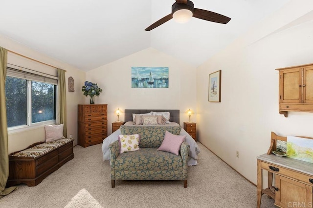 bedroom featuring lofted ceiling, a ceiling fan, and light carpet