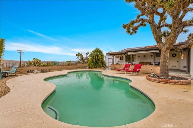 view of swimming pool featuring a patio area, a fenced in pool, and a fenced backyard