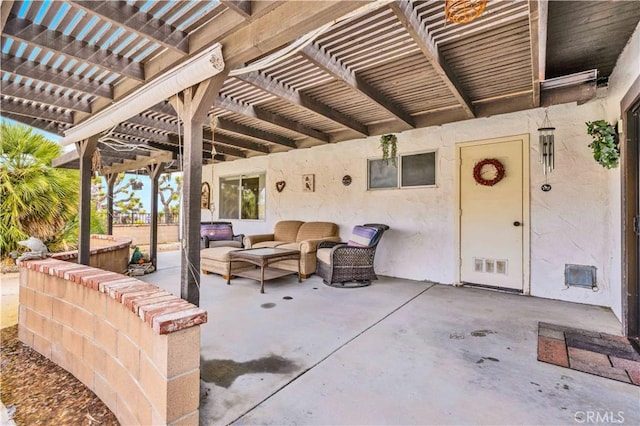 view of patio / terrace with an outdoor living space and a pergola