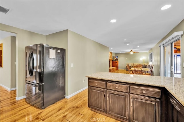 kitchen featuring visible vents, recessed lighting, light wood-type flooring, and freestanding refrigerator