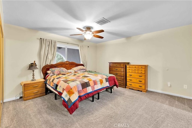 bedroom with visible vents, baseboards, carpet, and a ceiling fan