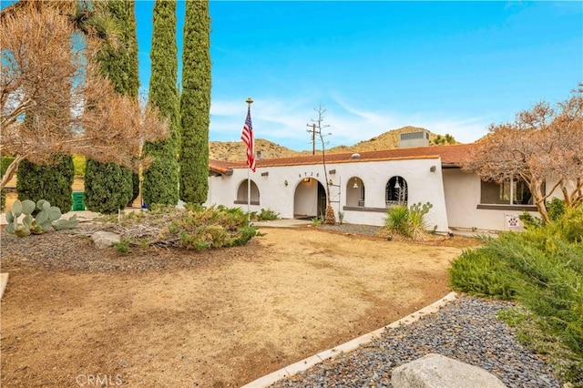 view of front of house featuring stucco siding