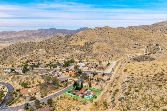 bird's eye view with view of desert and a mountain view