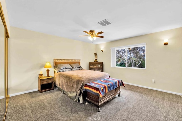 bedroom featuring visible vents, baseboards, and carpet