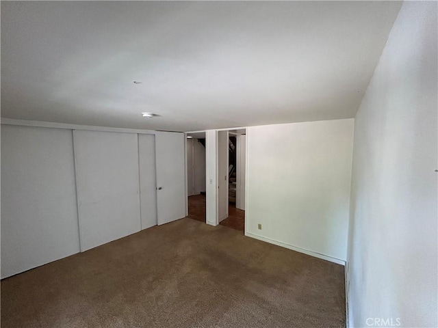 unfurnished bedroom with carpet floors