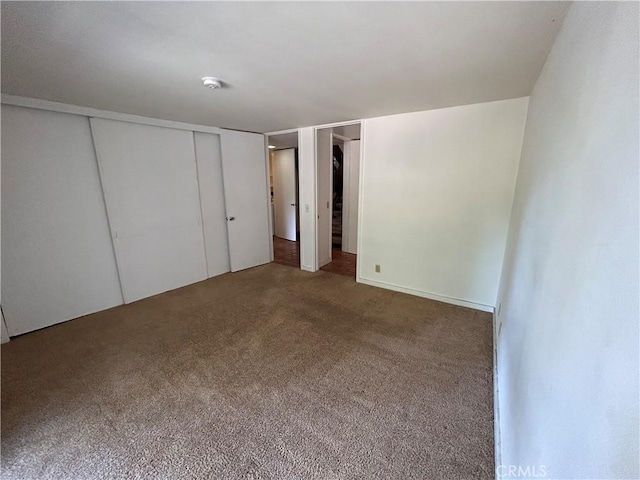 unfurnished bedroom with carpet flooring