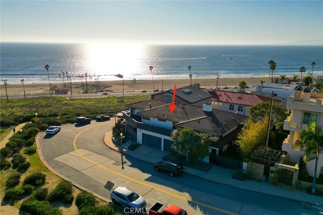 bird's eye view featuring a beach view and a water view