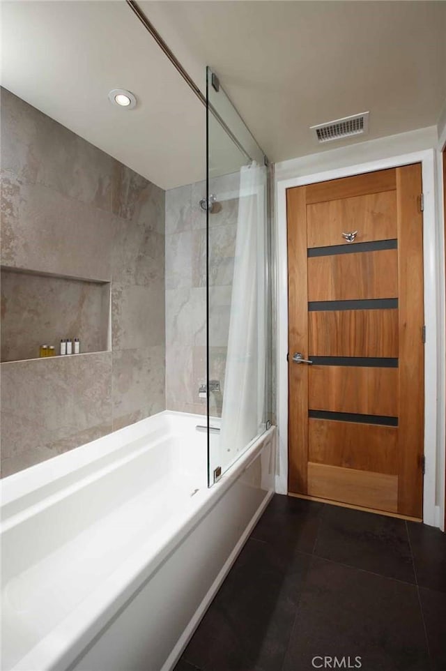 bathroom with visible vents, recessed lighting, tile walls, tile patterned flooring, and shower / bathtub combination