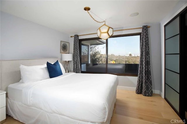 bedroom with light wood finished floors