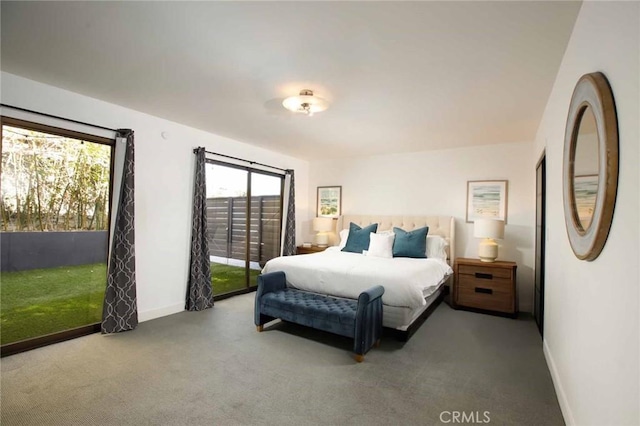 bedroom featuring baseboards, carpet flooring, and access to outside