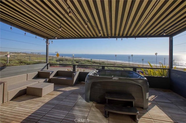 wooden deck with a water view