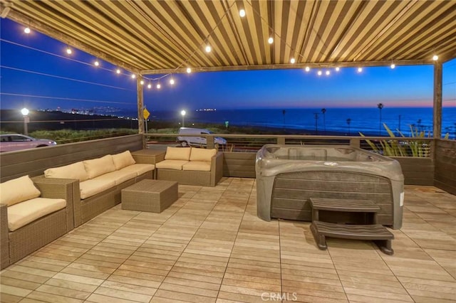 view of patio featuring an outdoor living space and a water view