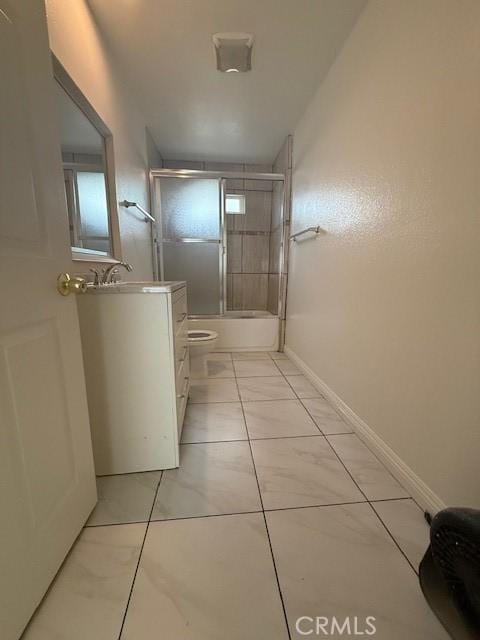 corridor with baseboards and a sink