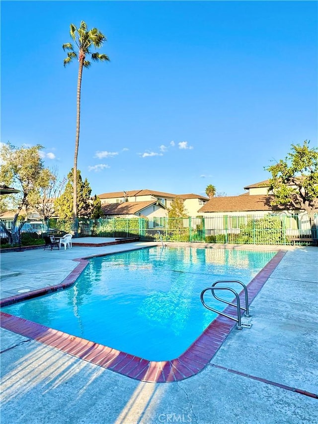 view of swimming pool with a fenced in pool, a patio area, and fence