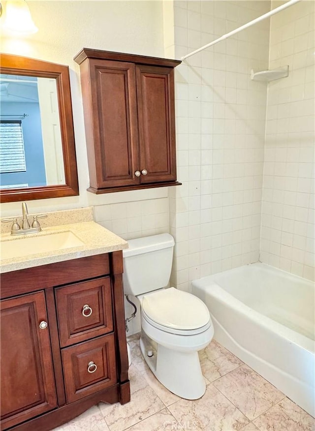 full bathroom with washtub / shower combination, toilet, and vanity