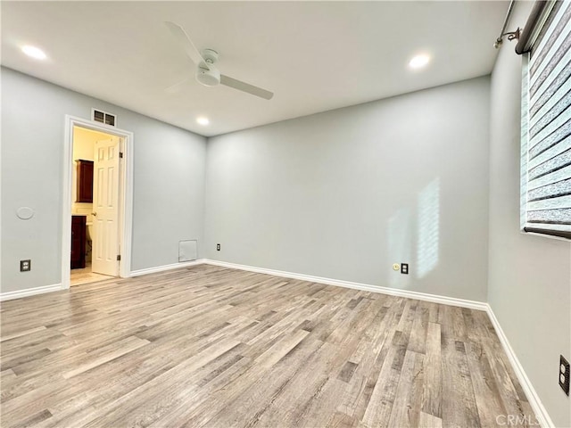 empty room with light wood finished floors, visible vents, baseboards, recessed lighting, and a ceiling fan