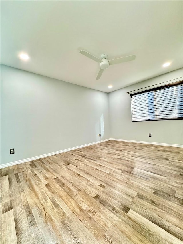 empty room featuring recessed lighting, light wood-type flooring, baseboards, and ceiling fan