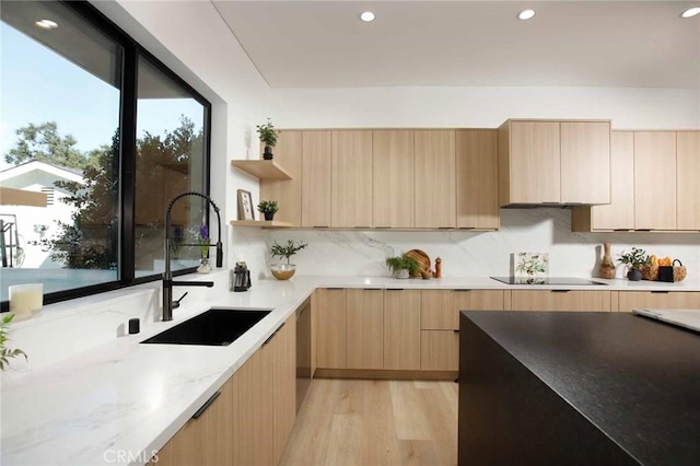 kitchen featuring open shelves, a sink, light brown cabinetry, black electric stovetop, and modern cabinets