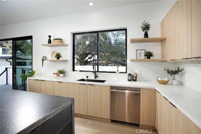 bar with recessed lighting, a sink, decorative backsplash, stainless steel dishwasher, and light wood-type flooring