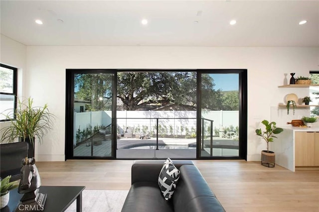 living room with recessed lighting and light wood finished floors