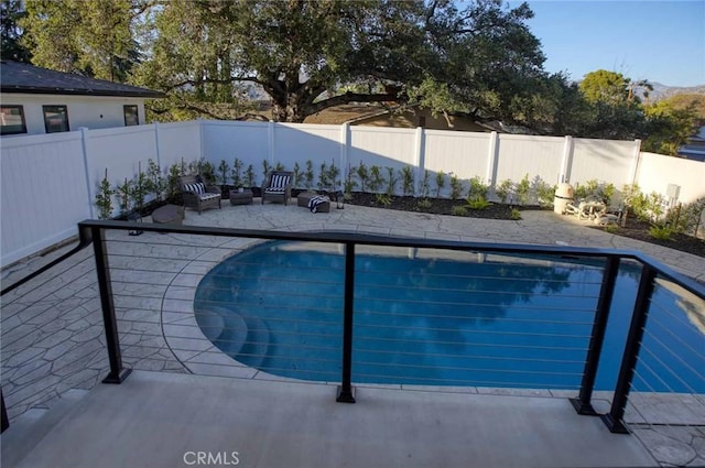 view of pool with a fenced in pool, a patio, and a fenced backyard