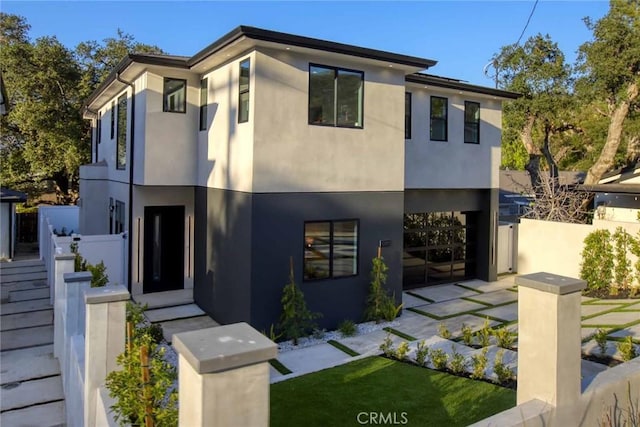 contemporary house featuring stucco siding